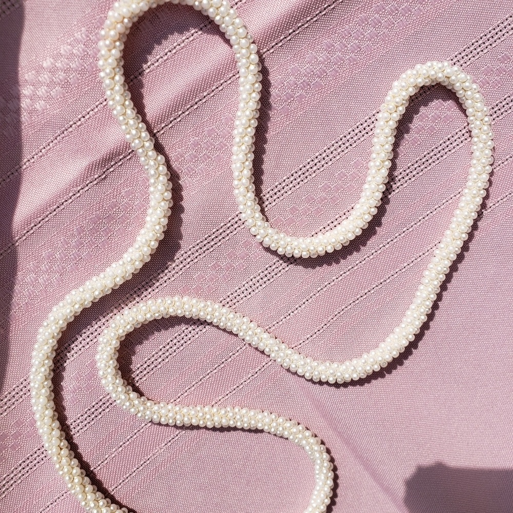 Faux Pearl single strand necklace.